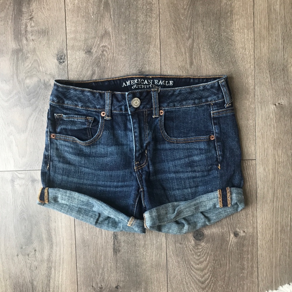 Dark blue denim rolled hem midi shorts